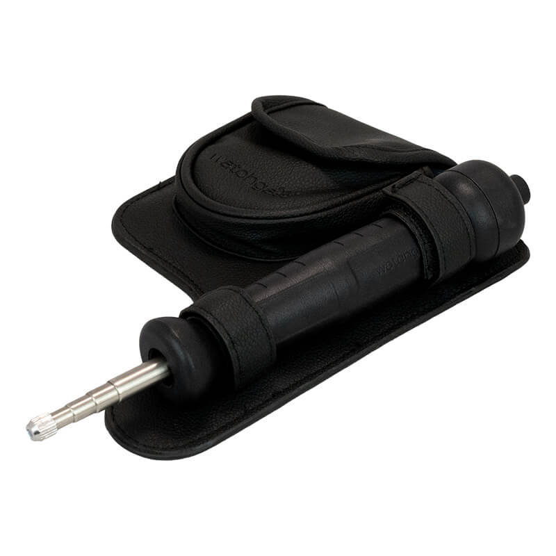 A black handheld tire inflator with a metal nozzle, engineered for convenience and portability, is shown resting on the WatchGas Aluminum Telescopic Probe’s black carrying pouch with a flap. Its durable construction pairs perfectly with the WatchGas Aluminum Telescopic Probe, enabling effortless inflation even in hard-to-reach areas.