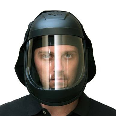 A person is wearing a PK Safety Supply Allegro Economy Supplied Air Face Shield, which features a clear visor for head and face protection. The helmet appears sturdy and is complemented by a black shirt against a plain, unobtrusive background.