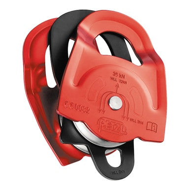 A Petzl TWIN Pulley P65A from PK Safety Supply, featuring a red body with a silver wheel and black accents, is engineered for climbing or rescue operations. It includes an advanced progress capture system, and its embossed details display specifications and branding, making it an essential component of a dependable haulage system.