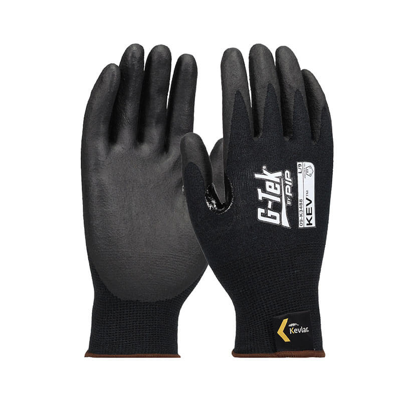 A pair of PIP G-Tek KEV gloves with black Kevlar, foam nitrile grip, and white "G-Tek" and "PIP" labels, plus a yellow Kevlar logo near the wrist. These cut-resistant gloves offer durable safety for various tasks.