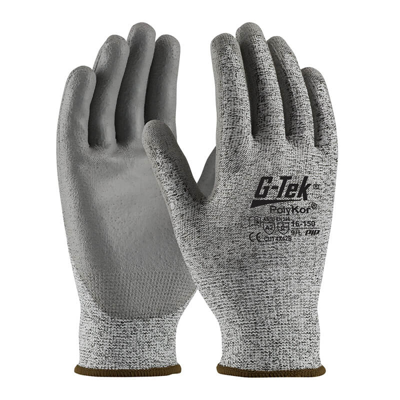 A pair of gray PIP PolyKor Blended Polyurethane Coated Gloves 16-150, featuring polyurethane-coated palms and black text on the back, designed by Protective Industrial Products for mechanical hazard protection. The seamless knit construction provides enhanced flexibility and grip. The gloves are displayed with palms facing forward and slightly angled.