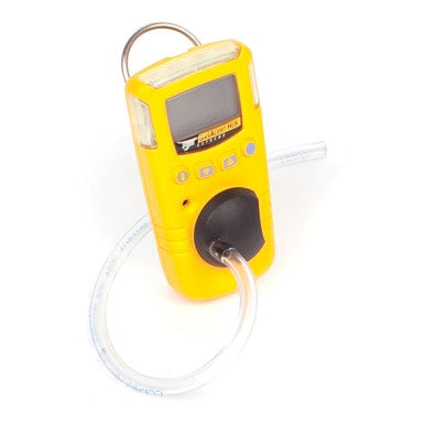 The BW Test Cap with Hose GA-TC-1 from BW Technologies by Honeywell is a compact yellow gas detector featuring a digital display, black button, clear sampling tube, and top metallic ring for easy carrying or attachment, making it essential for reliable gas detection.