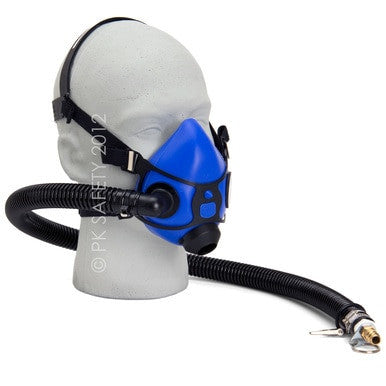 An Allegro Half Mask Constant Flow Airline Respirator 9920 from PK Safety Supply is fitted on a mannequin head, featuring a blue half-mask with an attached hose. The hose, engineered for continuous airflow, ends with a metal connector to attach to an air supply. The mask includes adjustable straps and a silicone facepiece for a secure fit.