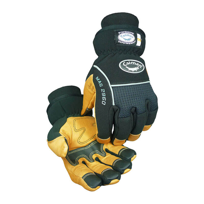 A pair of durable work gloves from PIP - Protective Industrial Products, the "PIP Caiman MAG Multi-Activity Glove w/Pig Grain Leather," features a black and tan leather design with protective padding and stitching. The model is equipped with a waterproof back, making it suitable for various tasks.
