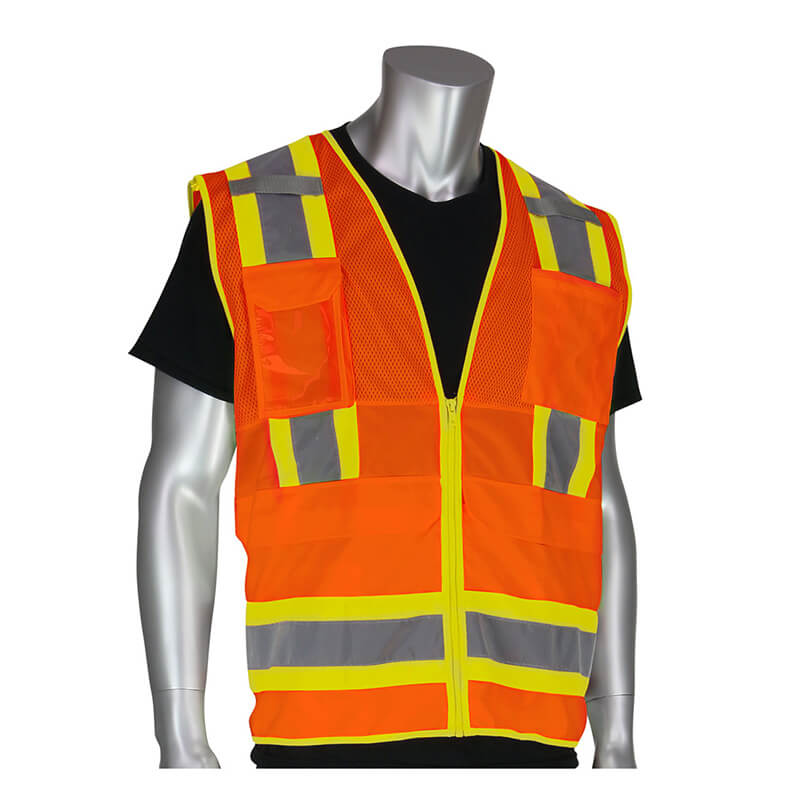 A mannequin wears a black shirt and blue pants under a PIP Hi-Vis Orange Pocket Surveyors Tech Vest 302-0700OR, featuring ANSI/ISEA 107 Class 2 compliance with yellow and silver reflective tape and multiple pockets.
