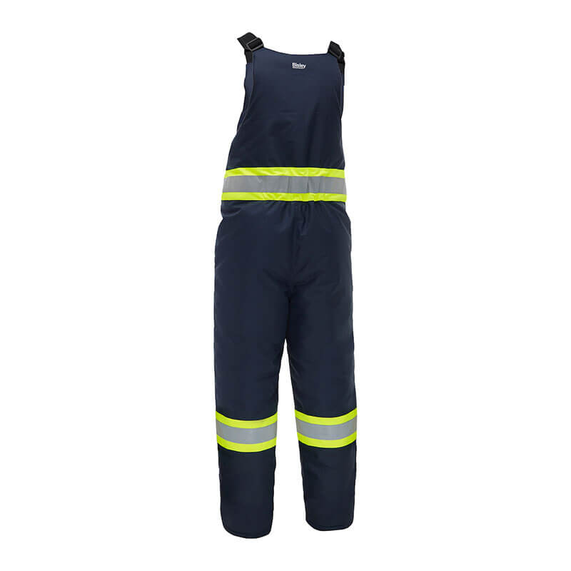 The PIP Bisley Navy Extreme Cold Bib Overall 318M6459T by PIP features adjustable shoulder straps and two horizontal reflective yellow stripes at the waist and legs for enhanced safety and visibility.