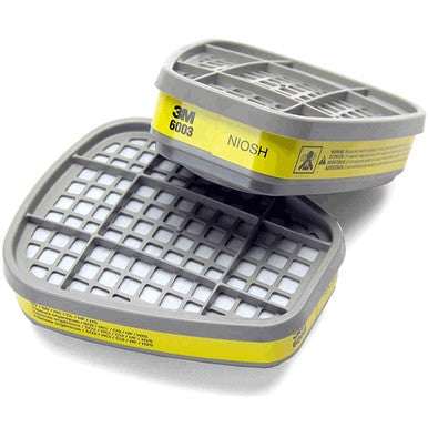 A pair of 3M 6003 Organic Vapor / Acid Gas Cartridges, featuring yellow labels and grid-patterned tops, designed specifically for respirators to offer protection against organic vapors and acid gases.