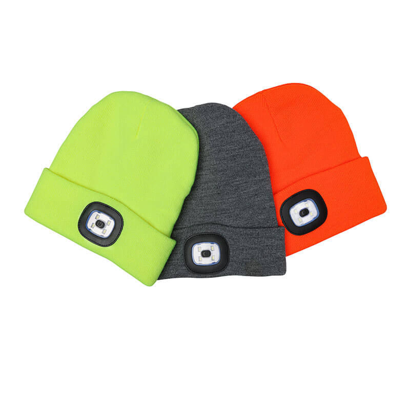 Three PIP Winter Beanie Caps with LED Light 360-LED from Protective Industrial Products are displayed, providing excellent protection against cold weather. These beanies are available in fluorescent green, gray, and orange, neatly arranged side by side on a crisp white background.
