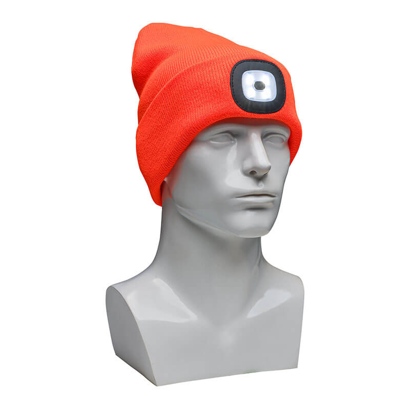 A display mannequin head showcases the PIP - Protective Industrial Products' Winter Beanie Cap with LED Light 360-LED in Hi-Vis Orange, ideal for cold weather protection.