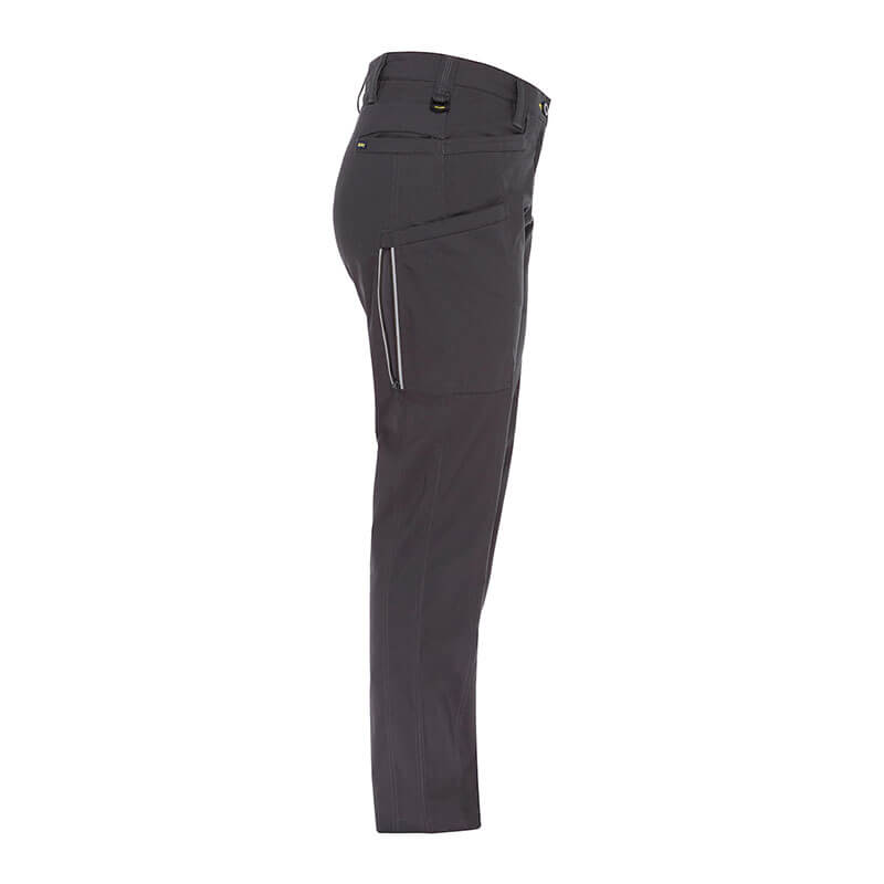 Here is the revised sentence with the given product data:
Side view of NSA PIP Bisley Women's Stretch Ripstop Vented Work Pants in dark gray, showcasing a zippered pocket and belt loops. With UPF 50+ protection and X-Airflow Ventilation, these sleek, fitted pants are ideal for outdoor activities or casual wear.