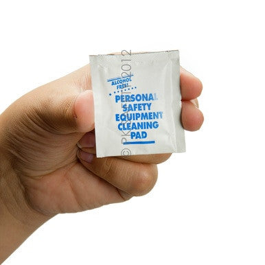 A hand holds a small, sealed packet labeled "Allegro 3001 Alcohol-Free Respirator Cleaning Wipes" by Allegro, ideal for alcohol-free cleaning of respirator facepieces.