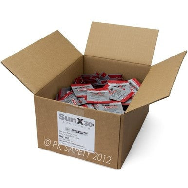 An open box of Coretex SunX SPF30 Sunscreen Pouches (300/Box) 71433 shows individually packaged red and silver towelettes inside, providing convenient, FDA compliant sun protection from the trusted Coretex brand.