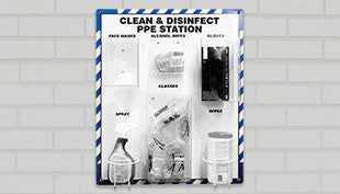 A "Clean & Disinfect PPE Station" mounted on a brick wall includes compartments for face masks, alcohol wipes, gloves, cleaner, spray, and wipes. It also features Honeywell Safety's Howard Leight Laser-Lite Disposable Corded Earplugs providing hearing protection with a Noise Reduction Rating (NRR) of 32. The station is designed with a blue and white striped border.