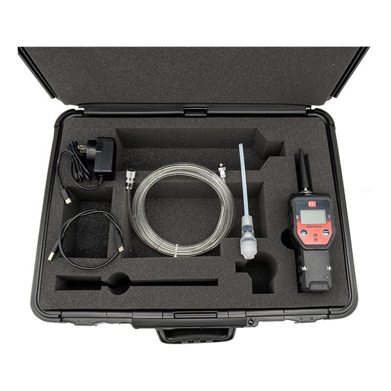 The RKI Instruments GX-Force 4 Gas Monitor with Case (72-FA-A-A10-50) includes a hard case, foam inserts, charger, USB cable, coiled tubing, probe, and adapter—organized for multi-gas detection in confined spaces.