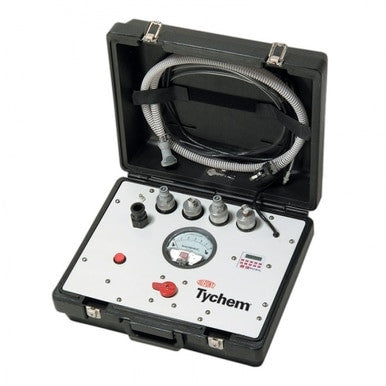 The open black hard-shell DuPont Universal Pressure Test Kit for Protective Suits by Dupont shows a control panel with "Tychem" label, gauges, knobs, connectors, a red button, and a coiled hose for testing chemical protective suits.