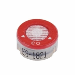 The RKI Carbon Monoxide Replacement Sensor ES-1821 by PK Safety Supply is a small, round sensor designed to fit the GX-2009 multi-gas detector. It features a red top labeled "CO" with a mesh center and white arrows, and "ES-1821" printed in black on the side.