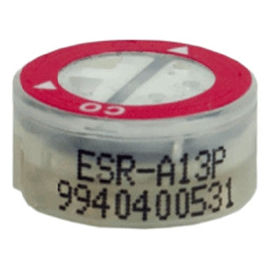 Close-up of the RKI Replacement CO Sensor ESR-A13P-CO by RKI Instruments, a small round component with "ESR-A13P 9940400531" printed on its red-marked top. It has a circular arrow and dashed line to indicate installation orientation, commonly used in gas monitors.