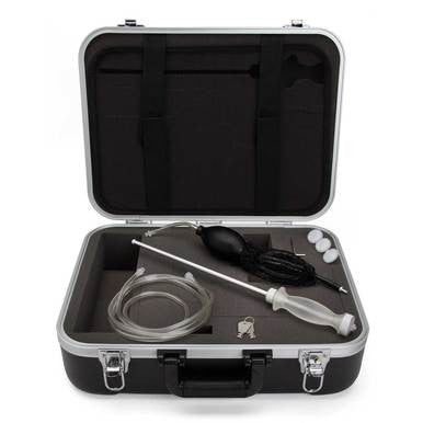 A black and silver carrying case is open, showcasing the RAE Systems QRAE II & QRAE III Compatible Accessory Kit 020-0040-010, with various tools neatly arranged inside. The contents include essential Gas Detector Accessories like a hose, pump, metal probe, and small items. Each component is set in custom foam lining for easy organization and protection by RAE Systems.