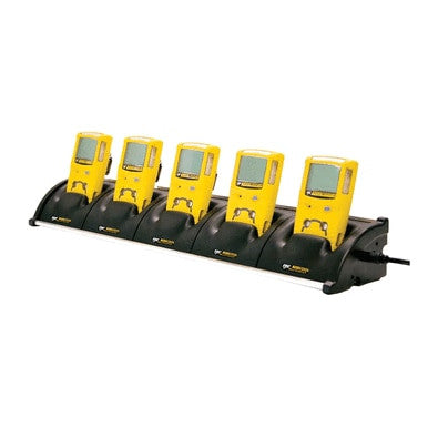 A BW Technologies GasAlert MicroClip 5 Unit Cradle Charger MC2-C01-MC5, in a sleek black design, neatly holds five yellow GasAlert MicroClip devices with screens, evenly spaced. This setup is ideal for charging or syncing multiple gas monitors at once.