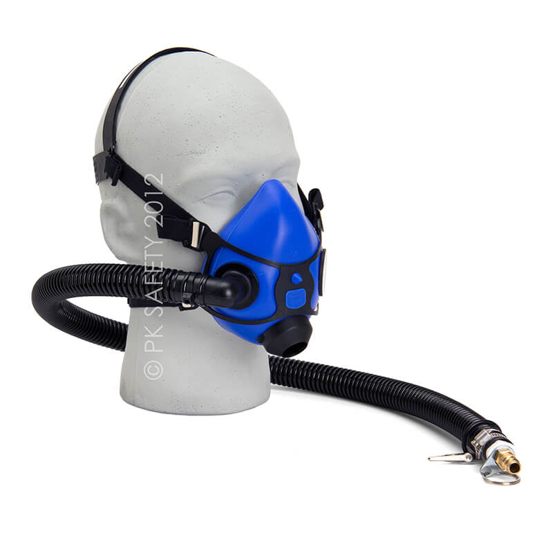 An Allegro Half Mask Constant Flow Airline Respirator 9920 from PK Safety Supply is fitted on a mannequin head, featuring a blue half-mask with an attached hose. The hose, engineered for continuous airflow, ends with a metal connector to attach to an air supply. The mask includes adjustable straps and a silicone facepiece for a secure fit.