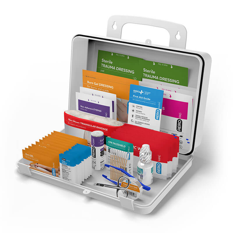 Introducing the PK Safety 25 Series First Aid Tough Kit 2021 by Aero Healthcare, an essential first aid kit featuring various medical supplies such as sterile trauma dressings, bandages, antiseptic wipes, scissors, and a guide. These items are systematically arranged within a sleek metal carrying case to promote optimal workplace safety.
