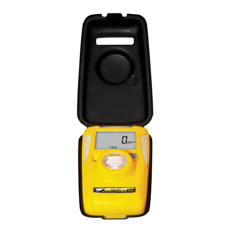 A BW Clip Hibernation Case CLIPHB-CASE in black, from PK Safety Supply, is open above a yellow gas detector with a digital display showing "0 ppm," exposing its screen, buttons, and sensor while highlighting the case's sleek design.