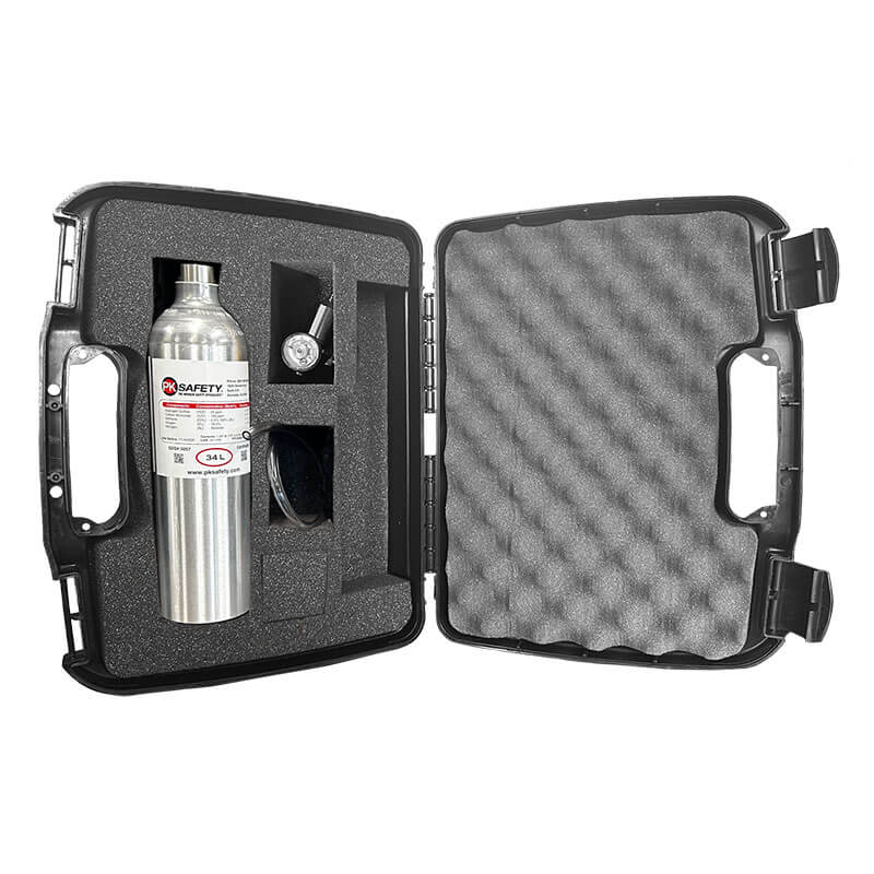 The PK Safety black hard case with foam padding, features custom-cut slots for the calibration kit, metal cylinder, pressure gauge, and small accessories. Case is open to display this organized gas detection set.
