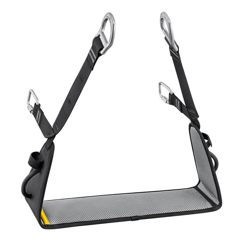 The Petzl VOLT International Version Work Seat C072EB00 is a black rectangular mesh seat with reinforced edges and four adjustable straps with metal carabiners, making it an ideal harness accessory for climbing or rope access work.