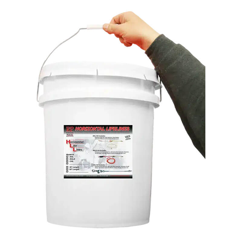 A person’s hand holds the handle of a large white plastic bucket labeled “French Creek CHL Wire Rope Horizontal Lifeline System” by French Creek Production, with instructions and an illustration showing its use for fall protection.