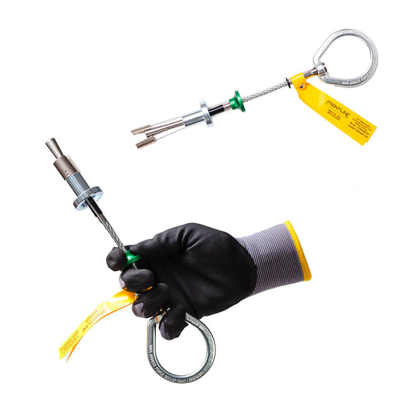 A gloved hand holds the Frontline Reusable 5K Anchor Bolt with Swivel D-Ring (COB345KSV) by Frontline Fall Protection, featuring metal components and a yellow safety tag; another similar device appears above on a white background.