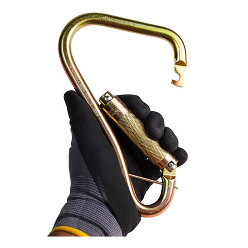 A gloved hand holds the Frontline Fall Protection Steel Quarter Turn-locking Carabiner Hook CSQ120, featuring a gold finish, textured grip, hook-shaped end, and auto lock gate. The background is white.