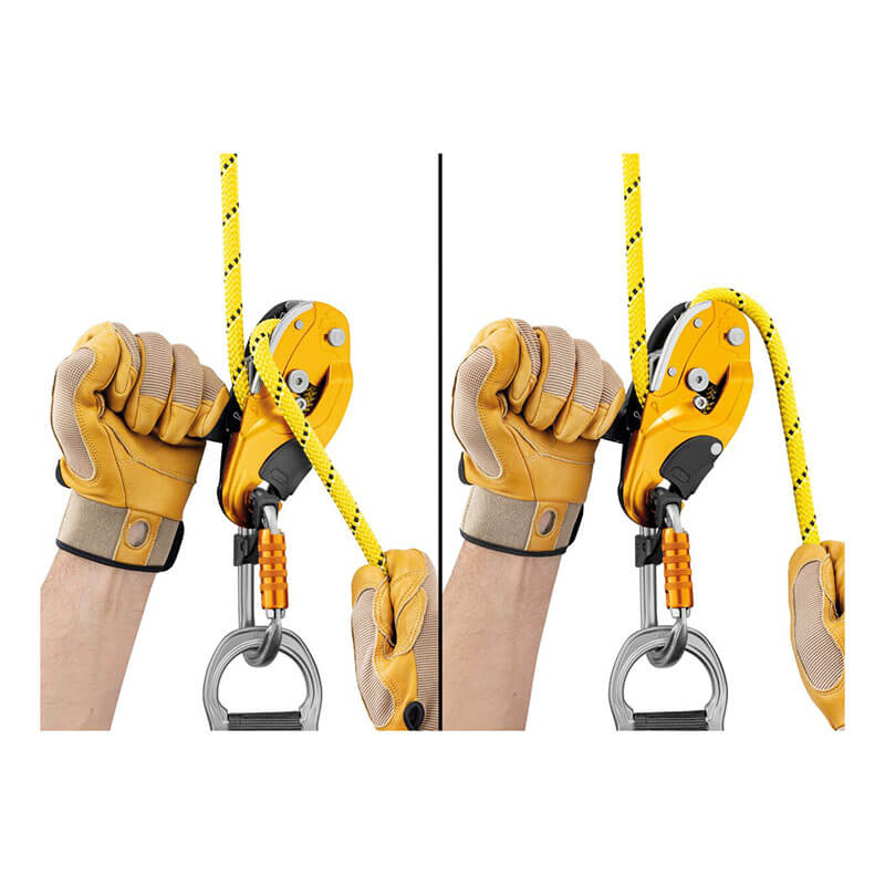 Two gloved hands use the Petzl RIG Compact Descender D021_ _00, attached to a climbing rope and carabiner, showing its operation in two different positions.