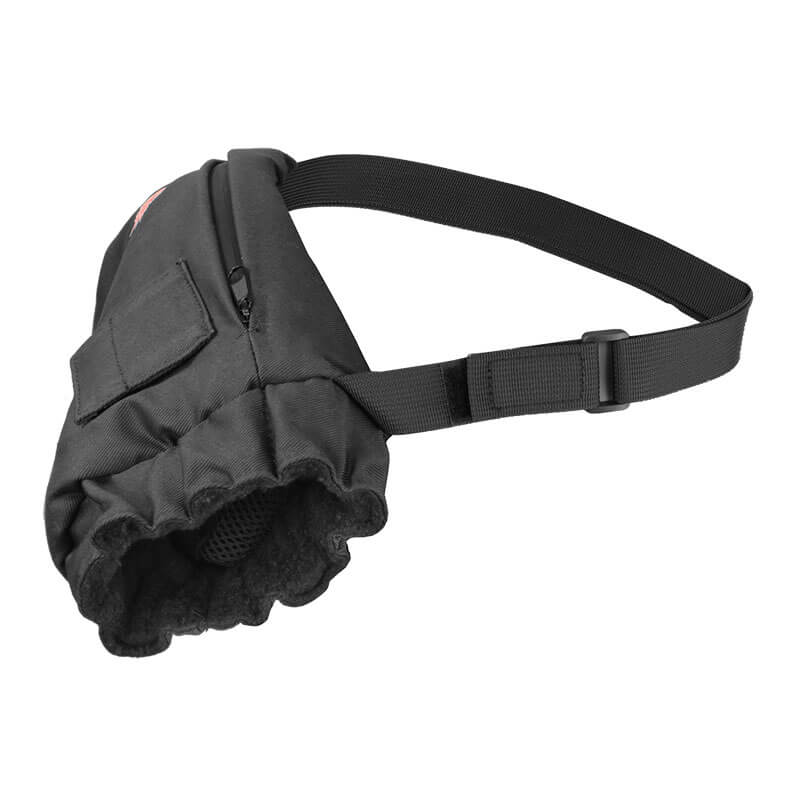 The NSA DRIFIRE FR Heated Hand Warmer fits easily into the small side pocket of a black dog muzzle with an adjustable nylon strap and mesh front—keeping your dog comfortable and warm in cold weather with a secure fit around the snout.