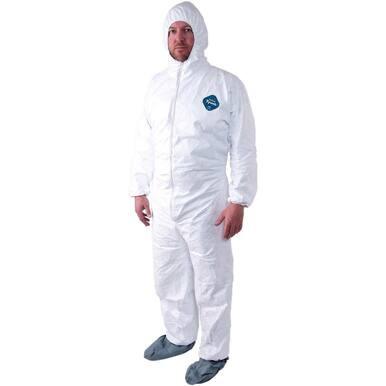 A person dressed in a full Dupont Tyvek TY122S Coverall Suit, complete with a hood and shoe covers, stands against a plain backdrop. The protective coverall is distinguished by a small blue logo on the chest, highlighting its reliability as a disposable hazmat suit from Dupont.