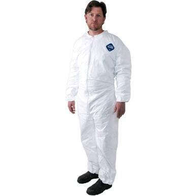 A man with short hair stands facing the camera in a Dupont Tyvek 400 TY125S Coverall Suit, featuring a blue logo on the chest. The full-body suit, designed for hazardous materials protection, includes long sleeves and pants and is paired with black shoes.