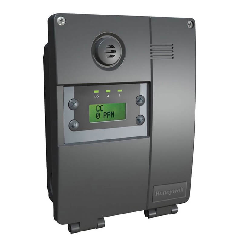 A Honeywell Analytics E3Point device, model E3SAH, featuring a digital display showing "CO 0 PPM" and indicator lights, comes in black. It includes smart cartridge technology housed within its vented circular section for a compact and efficient gas monitoring system design.