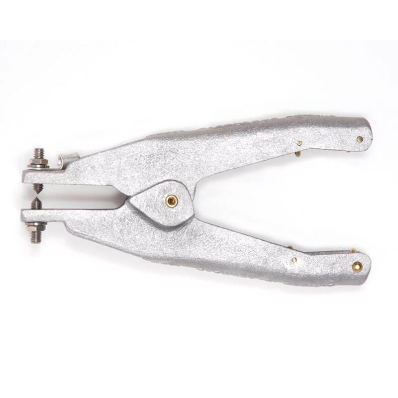 The Stewart R. Browne Retract-a-Clamp RAC is a metal hole punch tool with two textured handles, similar to RAC assemblies. It features a hinge and small screw mechanism, effectively complementing static grounding devices, all set against a white background.
