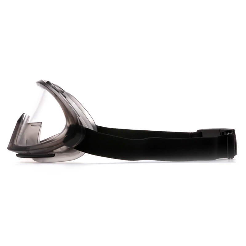 Side view of Pyramex Capstone Anti-Fog Safety Goggles GG504T by Pyramex Safety, featuring a clear lens, black frame, adjustable strap, and dependable impact protection; sold in 12 pairs.