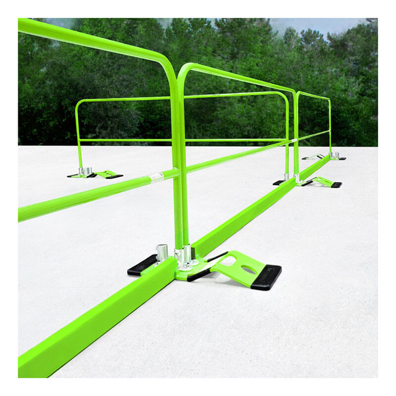 Frontline 10' Guardrail Toe Board GUTO by Frontline Fall Protection, in green, is installed on a flat white rooftop with black bases, offering OSHA-compliant safety and high visibility against a backdrop of trees.