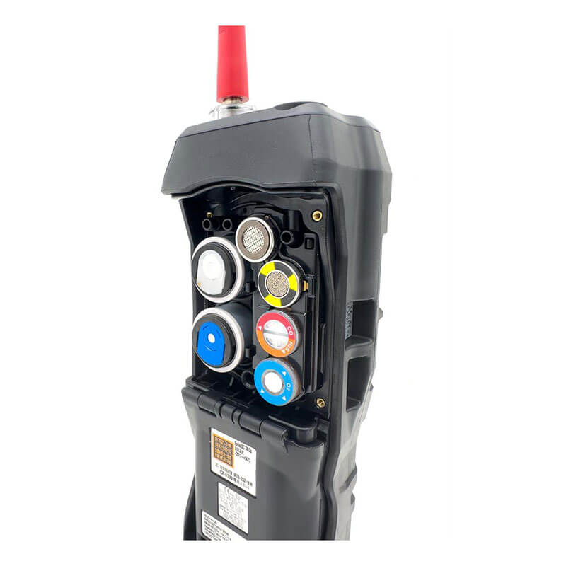 A close-up of the RKI Instruments GX-6100 Sample Draw with PID 6 Gas Monitor (72-61A_ _X-C), featuring a black casing, red antenna, and open compartment showing colored connectors—ideal for confined space entry.