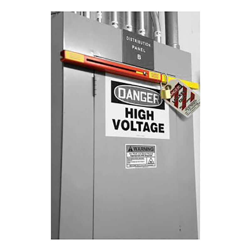 A gray electrical distribution panel labeled "B" displays a prominent "Danger High Voltage" sign. It is securely fastened with the Accuform Electrical Panel Lockout (Std) Kit KDD240KD and features a red and yellow safety tag. Multiple pipes are visible above the panel, ensuring safety while maintaining functionality.