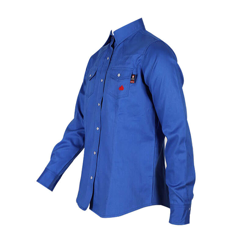 ForgeFR presents the Forge FR Ladies Solid Snap Shirt LFRSLD, a blue long-sleeve button-up FR shirt featuring two chest pockets. Displayed on an invisible mannequin and slightly angled to the side, this shirt is crafted with durable aramid sewing thread for NFPA 2112 flame resistance compliance.