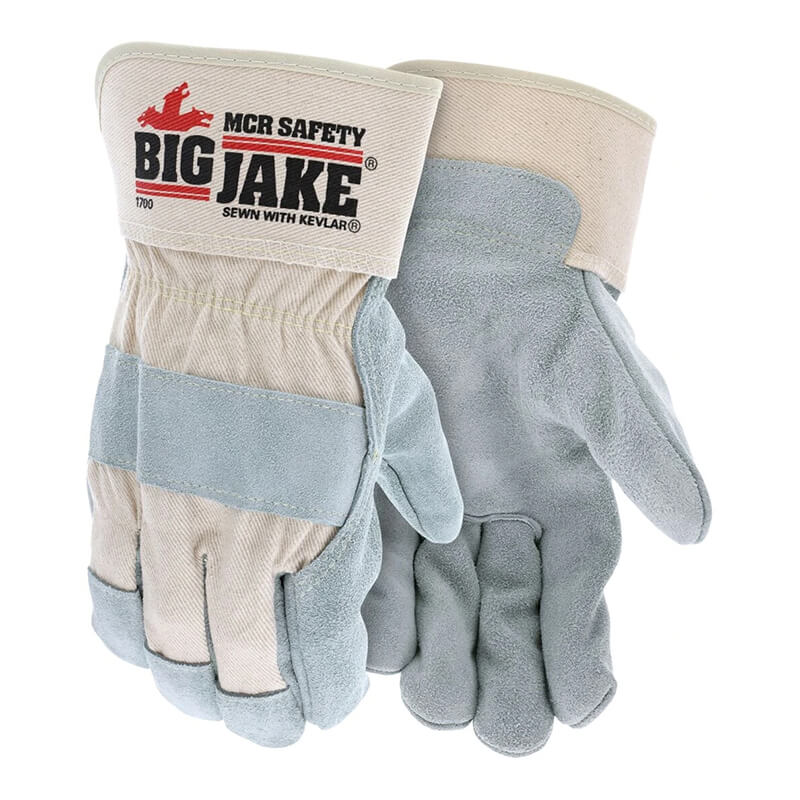 The MCR Memphis Big Jake Premium Leather Palm Work Glove 1700, by MCR Safety, offers heavy-weight side cowhide leather with reinforced palms and fingers. The left glove features a leather palm for safety and showcases the "Big Jake" logo, "MCR Safety," and "Sewn with Kevlar thread." Available in gray and beige.