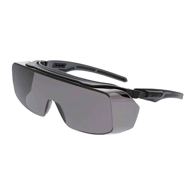 The MCR Safety Klondike OTG Series sunglasses boast a futuristic design with sleek black frames and dark lenses, providing wide wraparound coverage that embodies a minimalistic, modern aesthetic. Equipped with the MAX6 AF lens, they ensure clarity in all conditions.