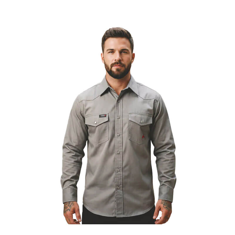 A man with short dark hair and a beard is wearing a gray ForgeFR Forge FR Solid Shirt MFRSLD-002 with two chest pockets, standing against a plain white background.