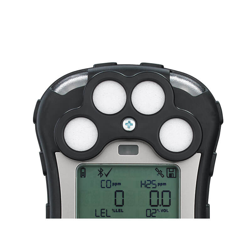 Close-up of the top section of the RAE Systems MicroRAE 4-Gas Diffusion Monitor M031-1111-200, displaying four circular sensors and a digital screen with gas readings and symbols.