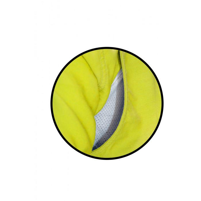 Close-up of a yellow DRIFIRE FR Premium Hi-Vis Vented Shirt by NSA with a circular cutout displaying grey, breathable workwear mesh underneath. A black circle outline frames the image.