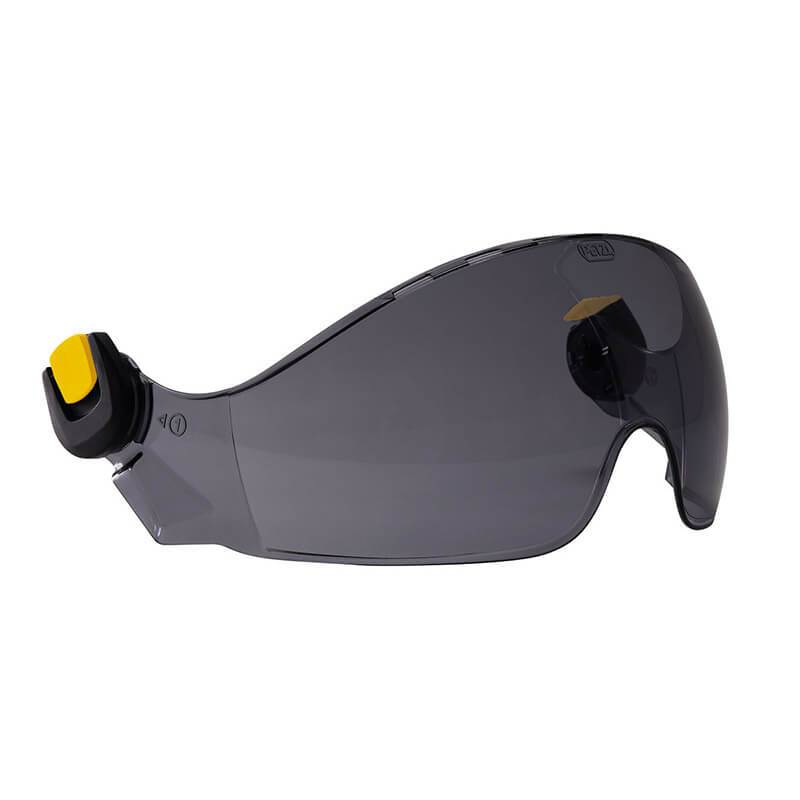 The Petzl VIZIR eye shield for VERTEX & STRATO is a pair of gray safety glasses with a wraparound design, equipped with built-in ear protection on the temples for projectile protection. The frame boasts a sleek look with yellow accents near the ear pieces.
