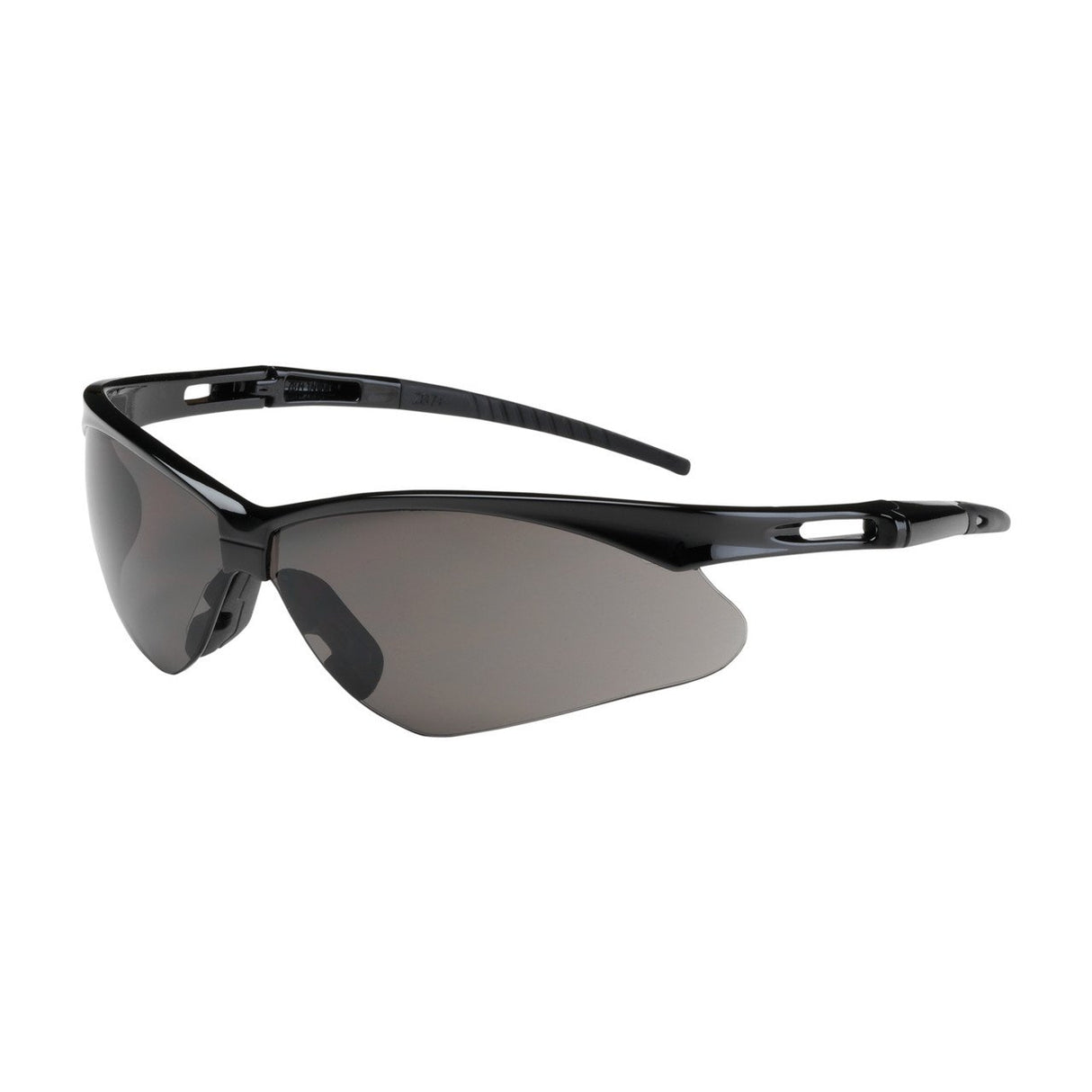 The PIP Anser Safety Glasses offer sleek black wraparound design with dark tinted lenses for eye protection. Featuring glossy frames, slightly curved temples, cutouts near the hinge, adjustable nose pads, and an anti-fog coating to ensure clarity. Sold as 12 per box.