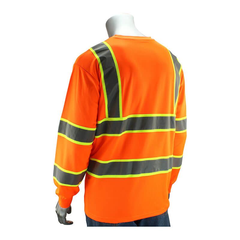 A mannequin showcases a hi-visibility apparel item: the PIP Type R Class 3 Two-Tone Long Sleeve by PIP - Protective Industrial Products, an orange safety shirt made from breathable polyester birdseye mesh, featuring reflective gray and yellow stripes.